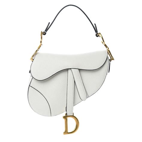 white and gold dior saddle bag